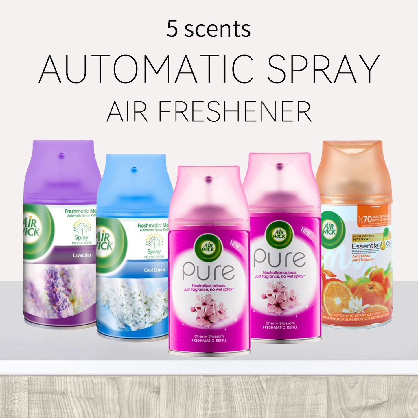 Five Air Wick air freshener spray bottles with different scents on a white background.