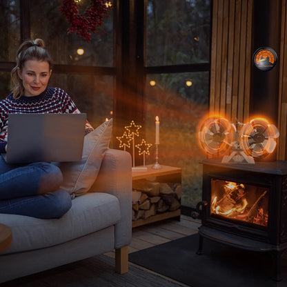 Woman using a laptop on a couch in a cozy room with a fireplace and decorative lights.