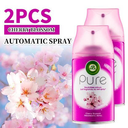 Two Air Wick Pure Cherry Blossom automatic spray refills with cherry blossom flowers in the background.