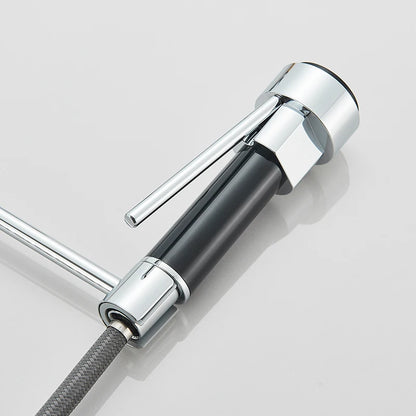 Chrome kitchen faucet with hose on a light gray background