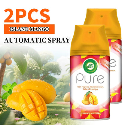 Two Air Wick Pure Island Mango automatic spray bottles with mangoes and a tropical scene in the background.
